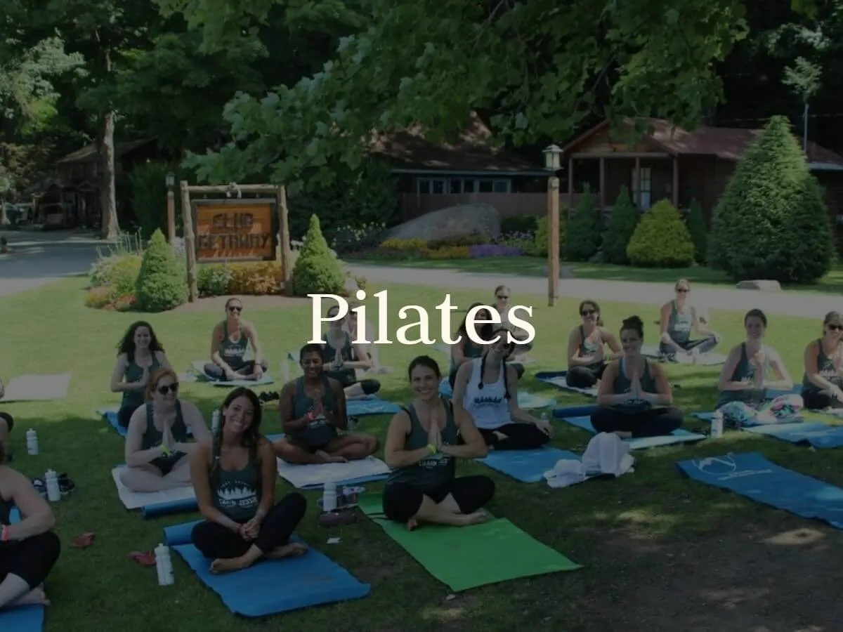 Guests on mats during an outdoor Pilates class