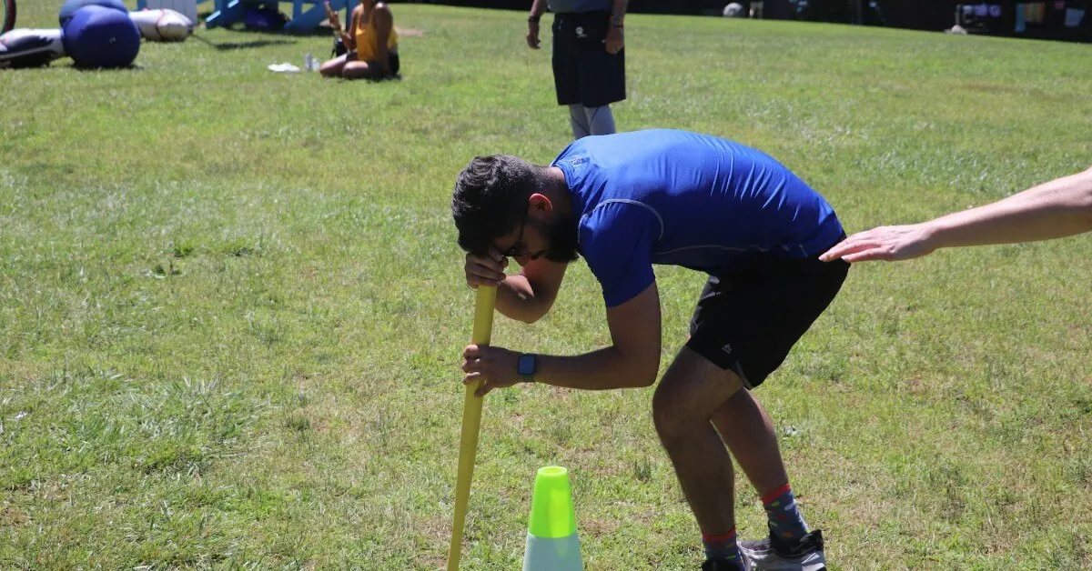 A dizzy guest spins around a bat during the blurry bat relay