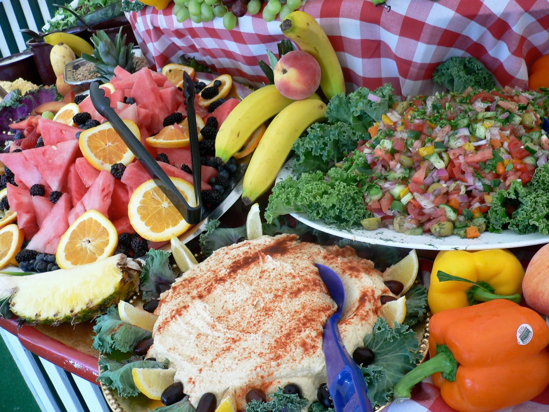 Buffet spread of fresh fruit, salads and dips