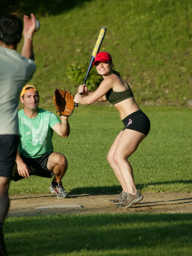 A softball game on the camp field, with a batter ready to swing