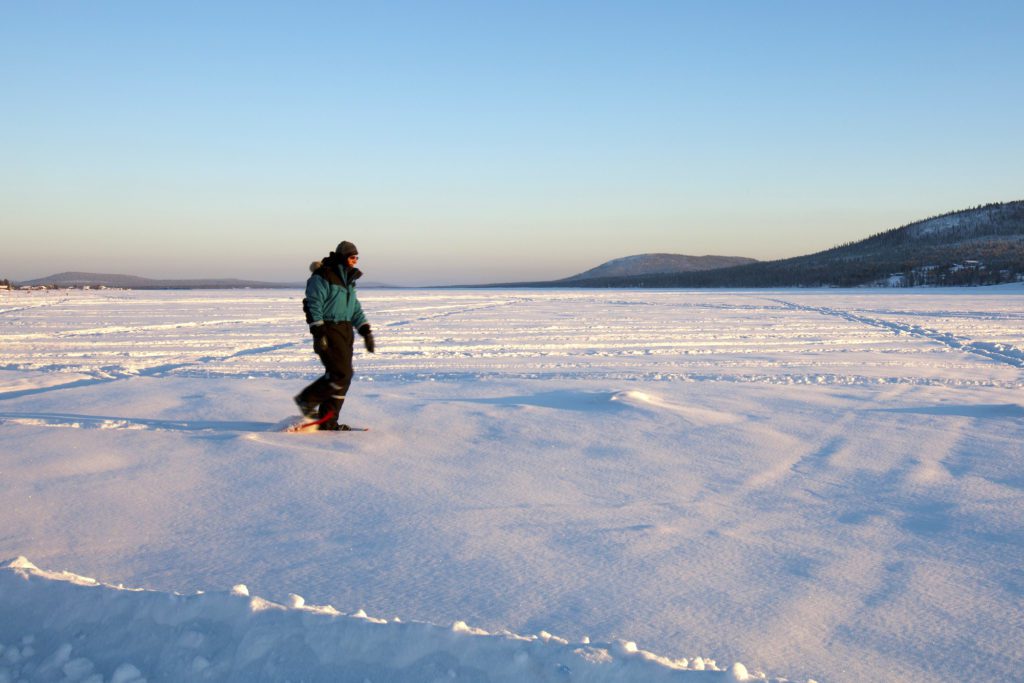 Snowshoeing on a frozen lake